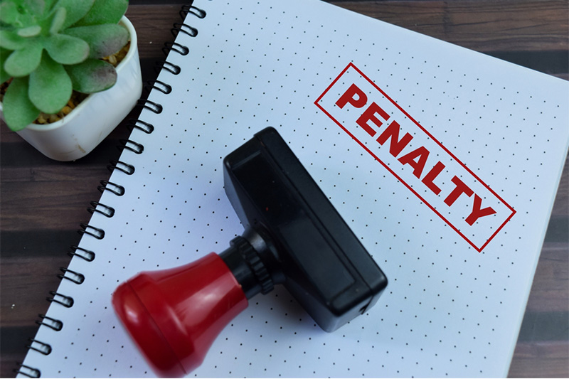 Red penalty stamp on document or legal paperwork